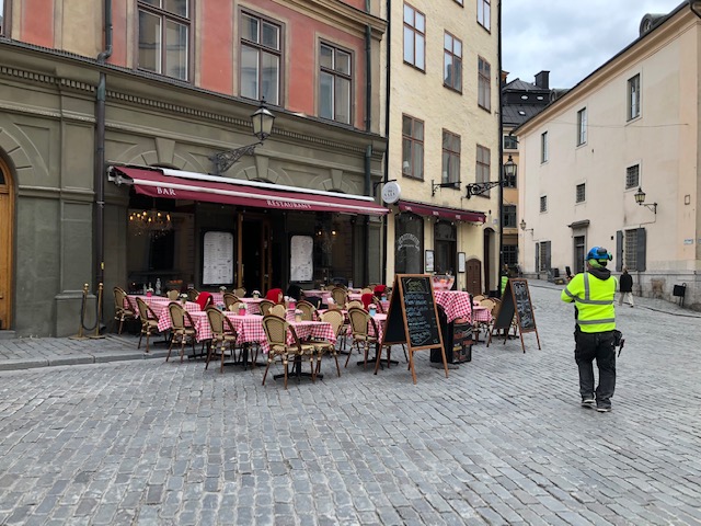 Restaurant with empty outdoor seats in Stockholm's old town